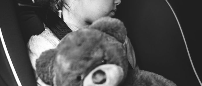 Little girl sleeping in the car